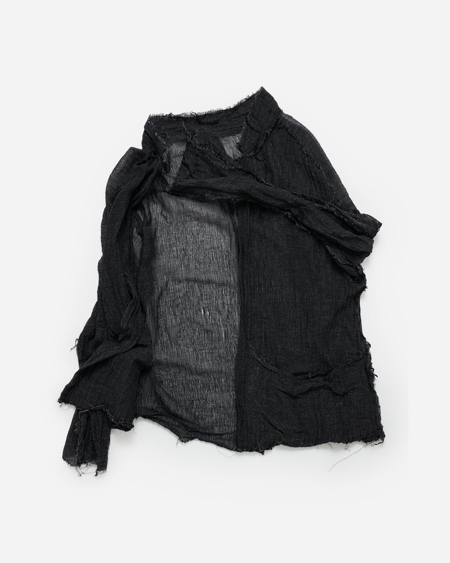 A black distressed linen shirt with raw, frayed edges and a sheer inner lining, laid flat on a white background.